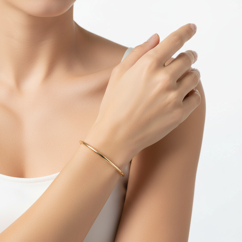 Generated image of a female model wearing small-sized yellow gold bangle bracelet