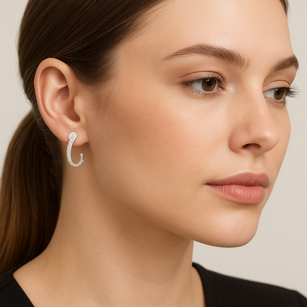 Generated image of a female model wearing the white gold and diamond hoop earrings in a smaller size