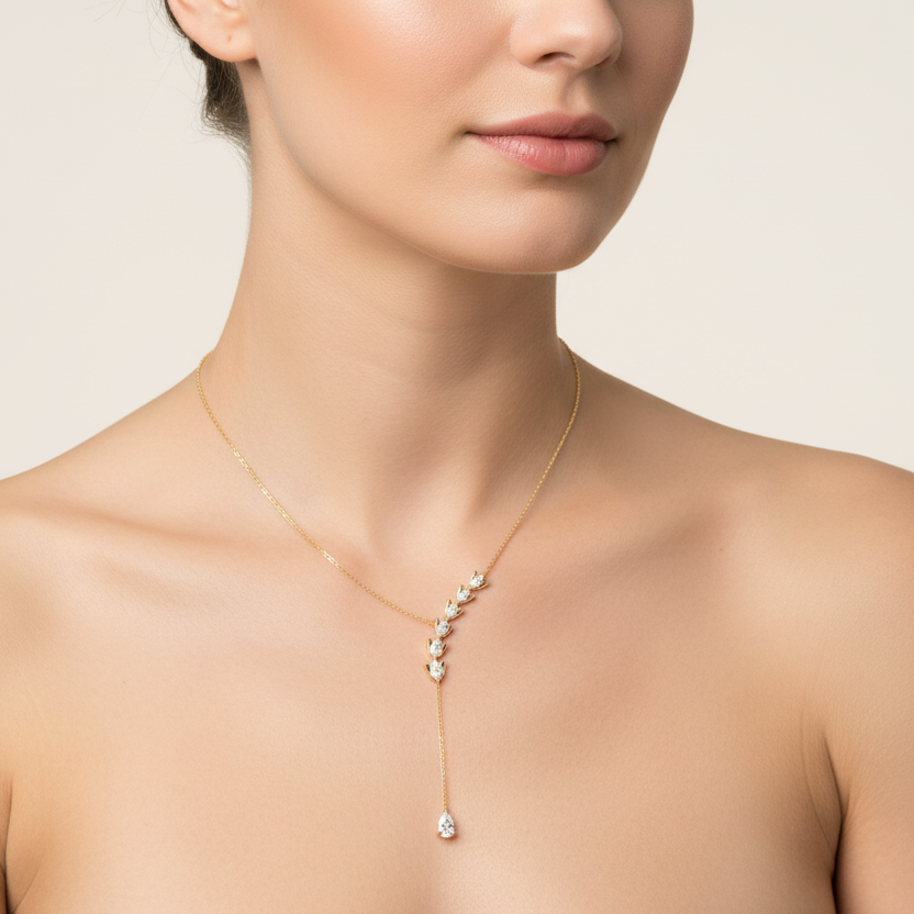 Generated image of a female model wearing the yellow gold diamond leaf lariat necklace