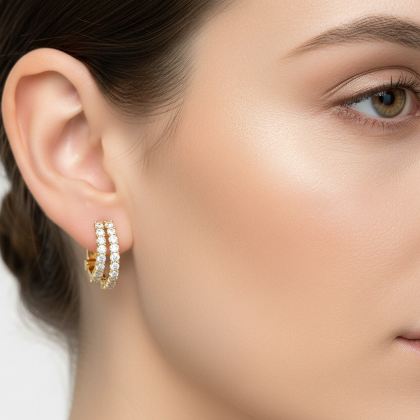 Generated image of a female model wearing the yellow gold double-row diamond huggie hoop earrings