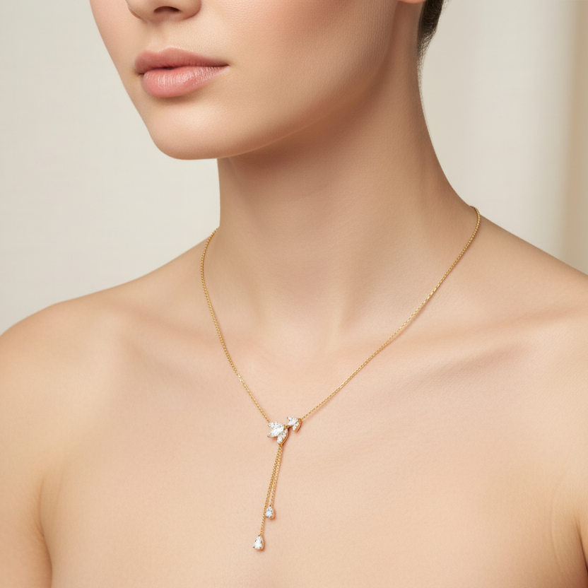 Generated image of a female model wearing the yellow gold lariat necklace with marquise and pear diamond drop