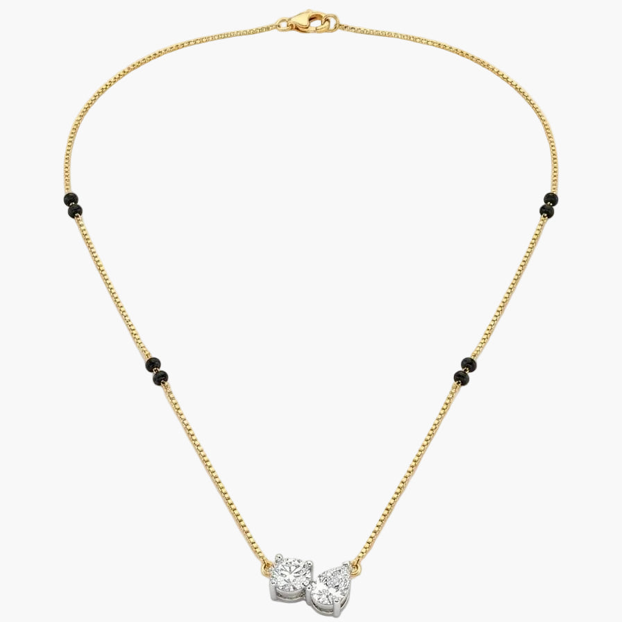 Gold necklace with a diamond pendant on a white background
