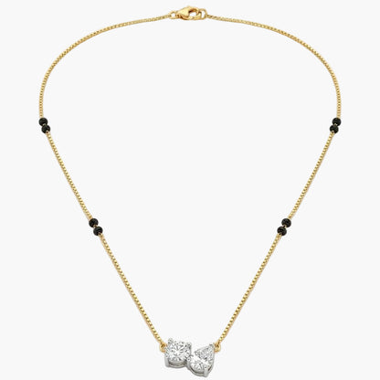 Gold necklace with a diamond pendant on a white background