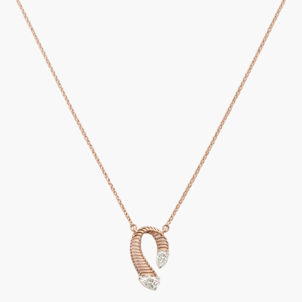 Rose gold necklace with a unique pendant on a white background
