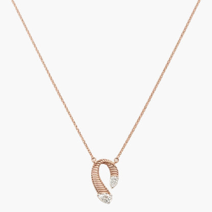 Rose gold necklace with a unique pendant on a white background