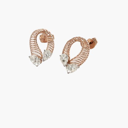 Rose gold hoop earrings with clear gemstones on a white background