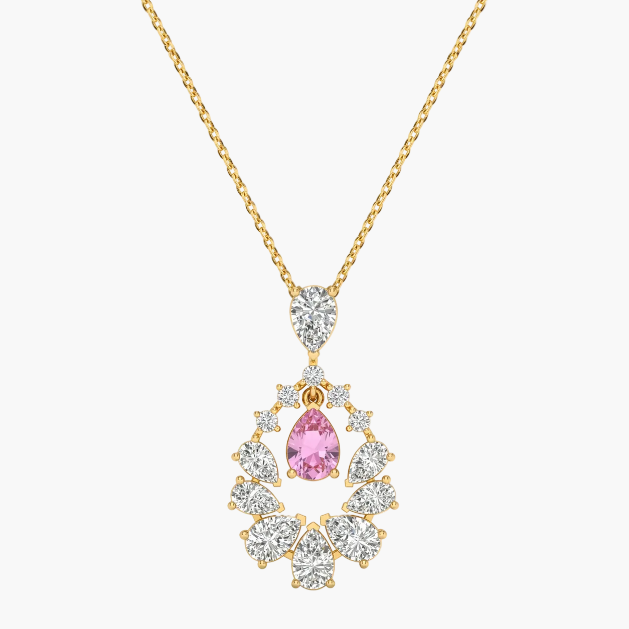 Gold necklace with a pink gemstone pendant on a white background