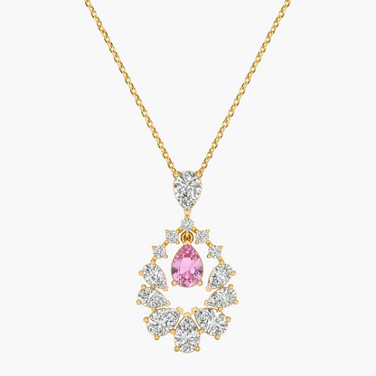 Gold necklace with a pink gemstone pendant on a white background