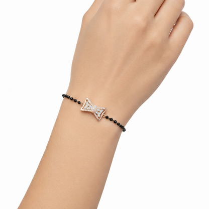 Bracelet with a decorative clasp on a wrist against a white background