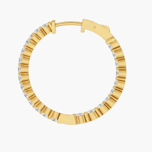 Gold hoop earring with diamond accents on a white background
