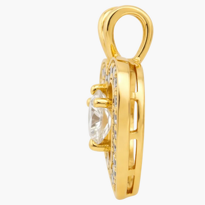 Gold pendant with a clear gemstone on a white background