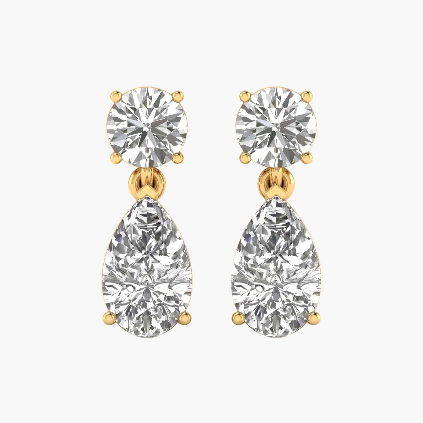 Pair of diamond earrings with gold accents on a white background