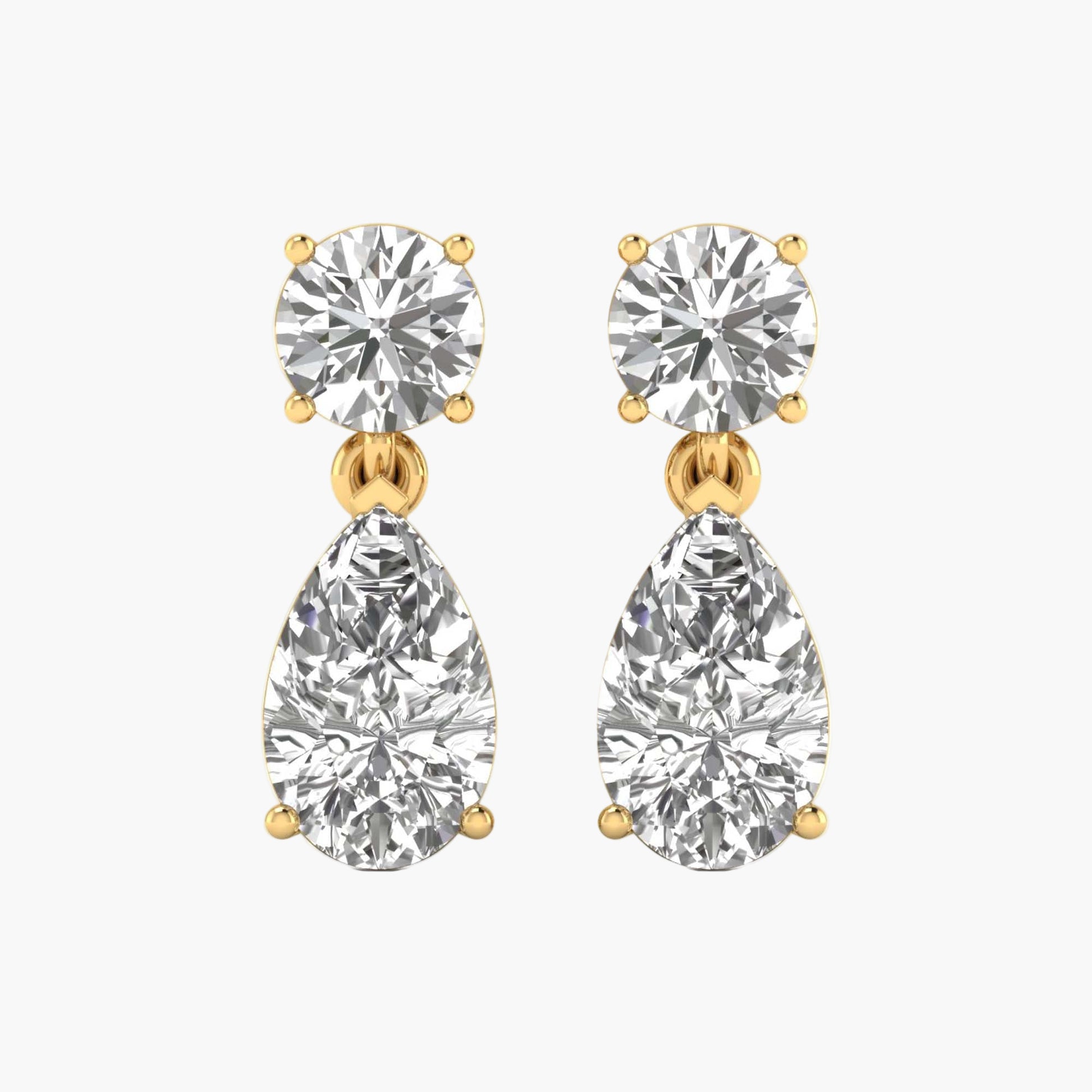 Pair of diamond earrings with gold accents on a white background