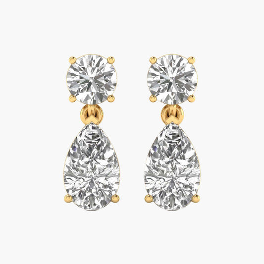 Pair of diamond earrings with gold accents on a white background