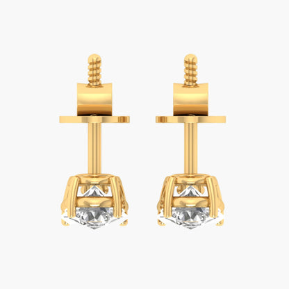 Gold earrings with clear gemstones on a white background