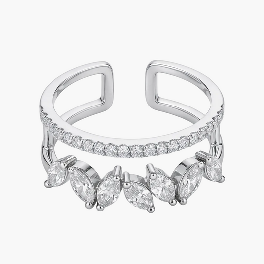 Silver ring with marquise-shaped gemstones on a white background