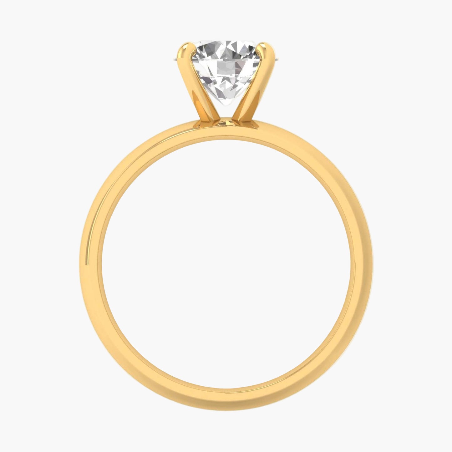 Gold ring with a clear gemstone on a white background