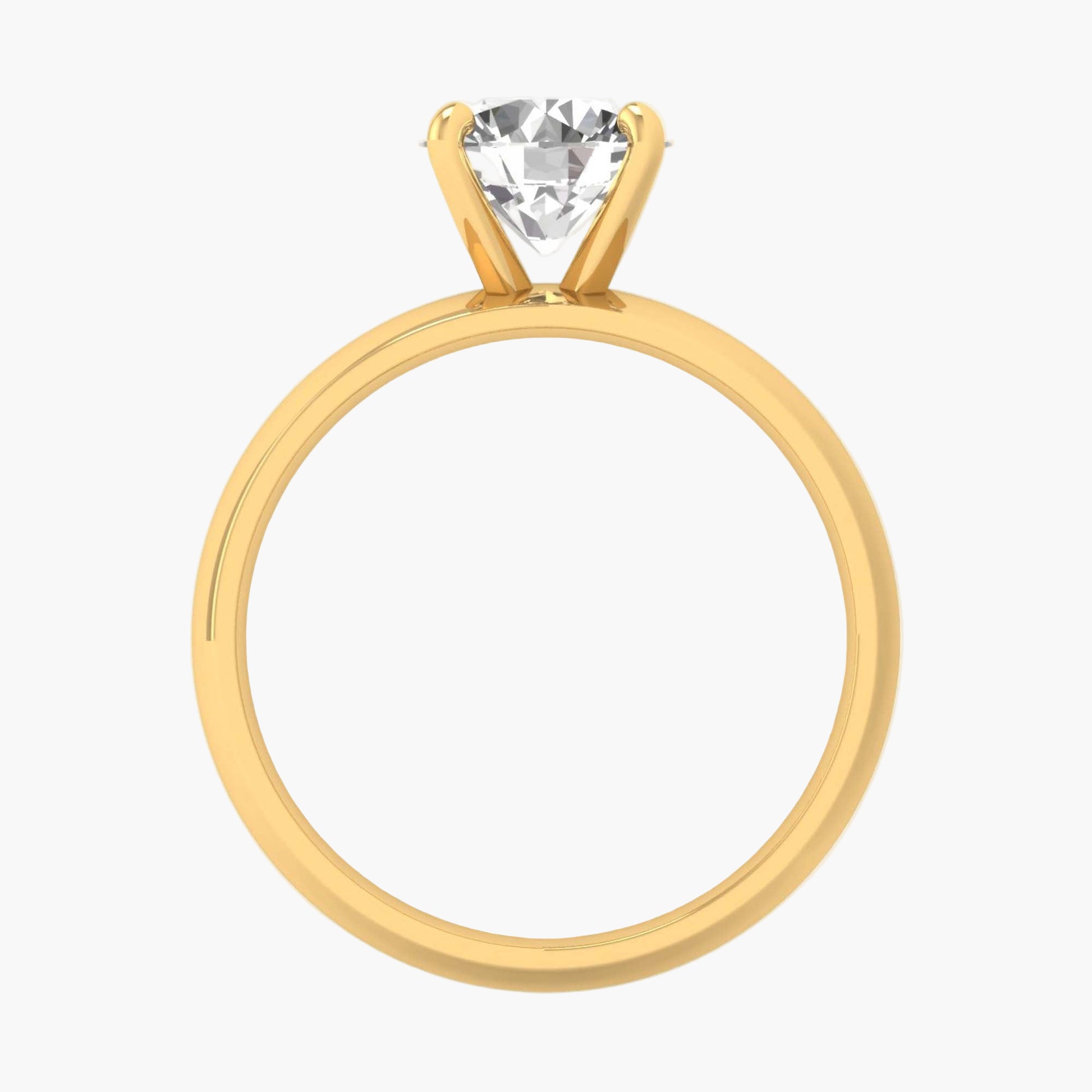 Gold ring with a clear gemstone on a white background