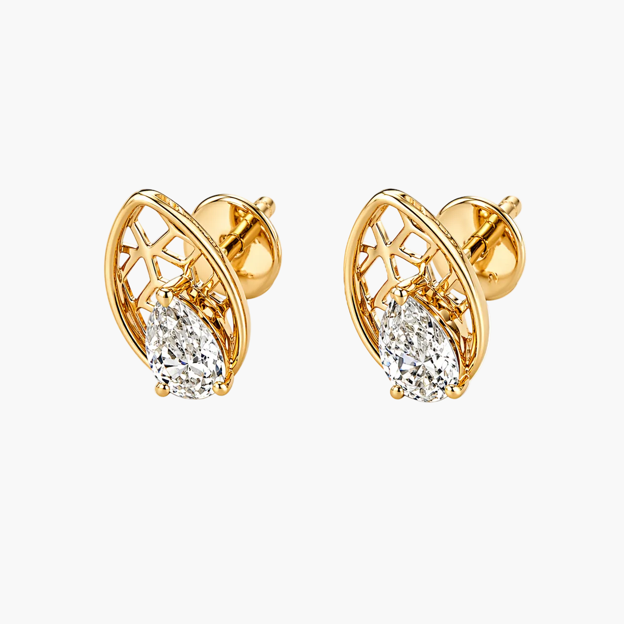 Gold earrings with clear gemstones on a white background