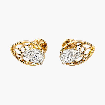 Gold earrings with diamond-like stones on a white background
