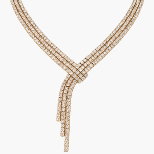 Rose gold necklace with diamonds on a white background