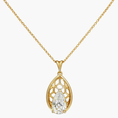 Gold necklace with a teardrop-shaped pendant on a white background