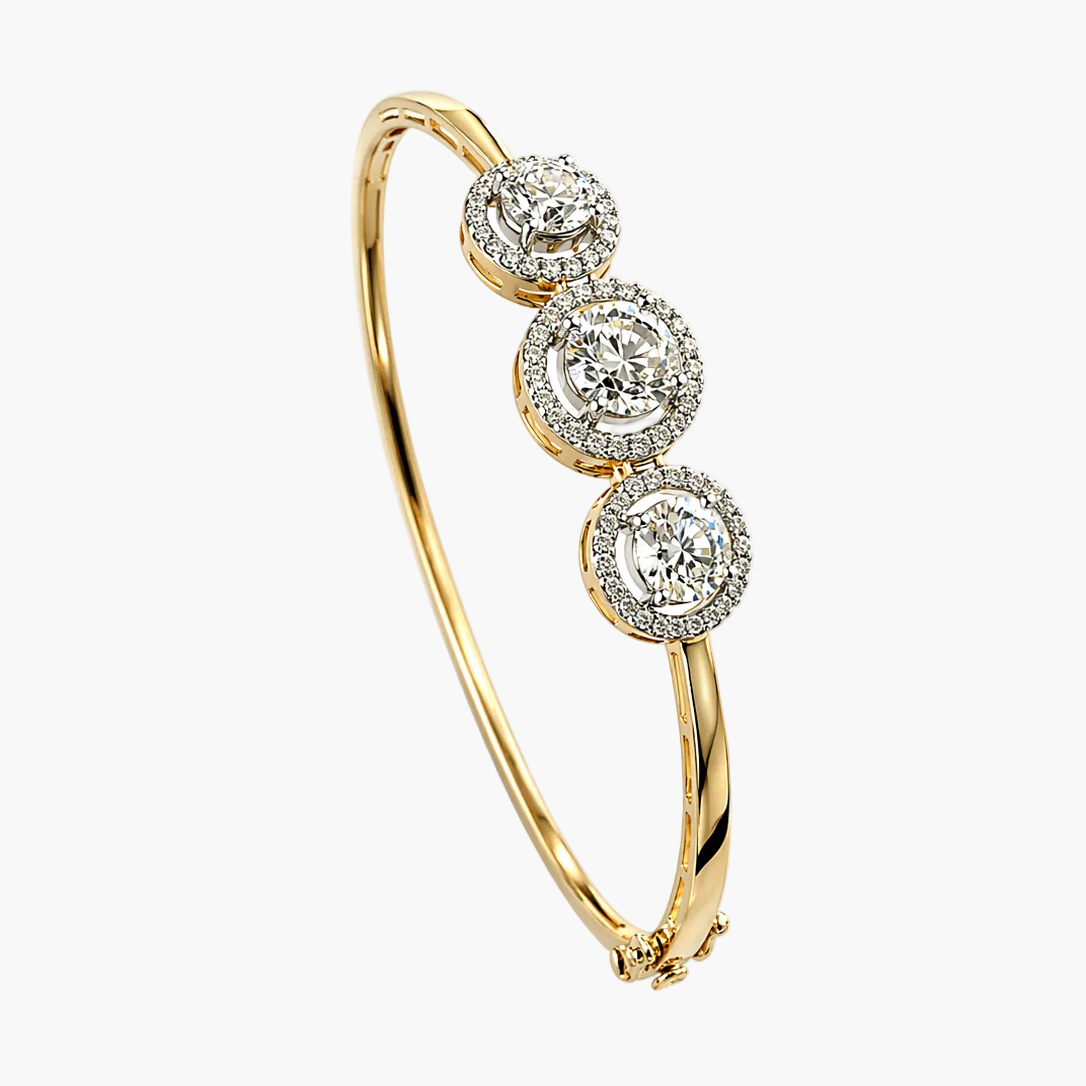 Gold bracelet with three diamond-like stone settings on a white background