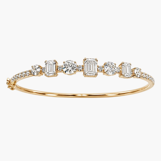 Gold bracelet with diamond accents on a white background