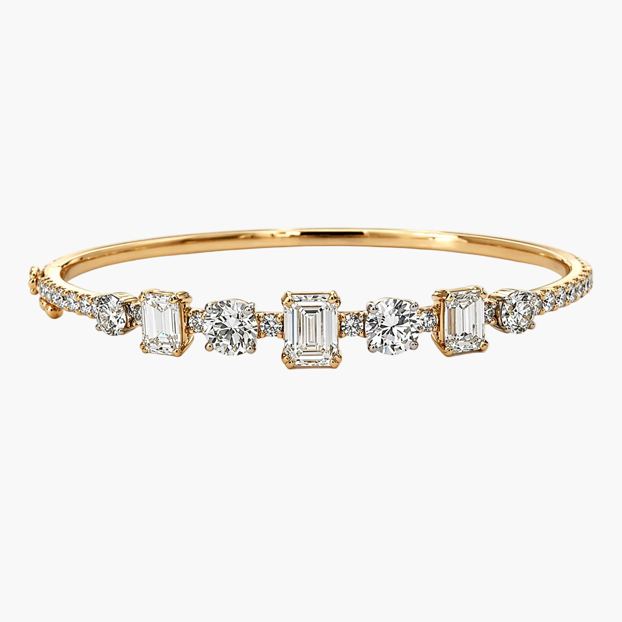 Gold bracelet with diamond accents on a white background