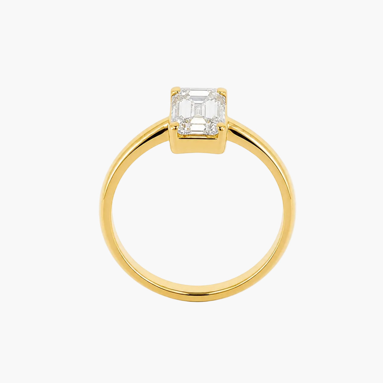 Gold ring with a diamond on a white background