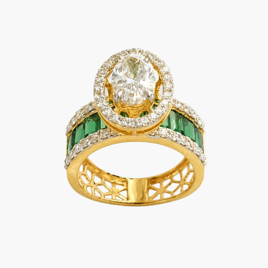 Gold ring with emerald and diamond accents on a white background