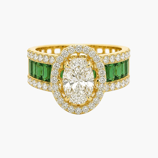 Gold ring with central diamond and emerald stones on a white background
