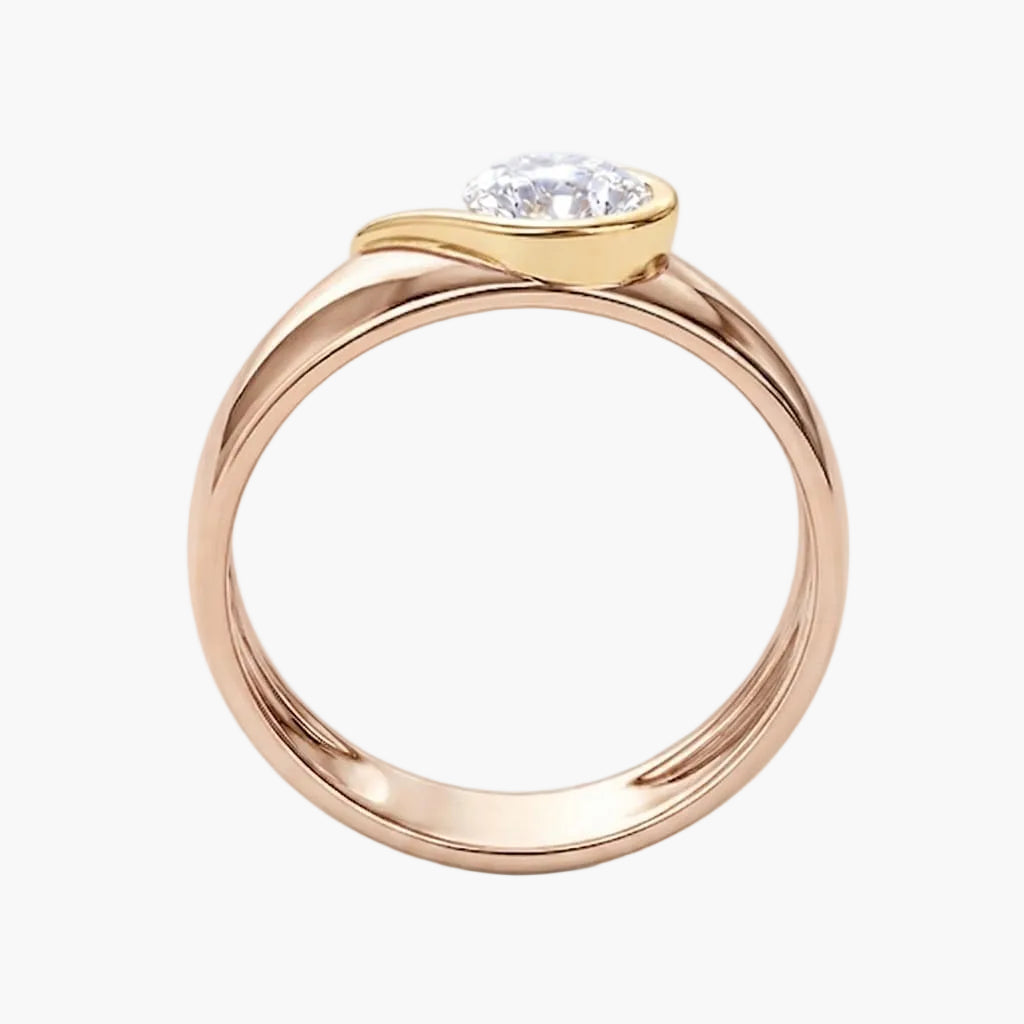 Rose gold ring with a diamond on a white background