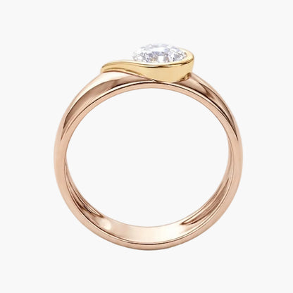 Rose gold ring with a diamond on a white background