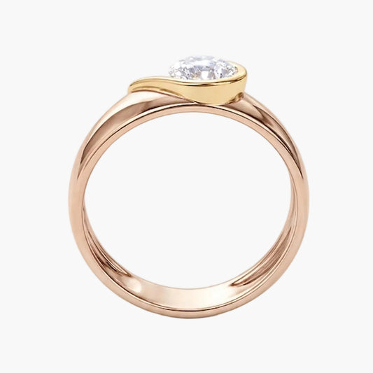 Rose gold ring with a diamond on a white background