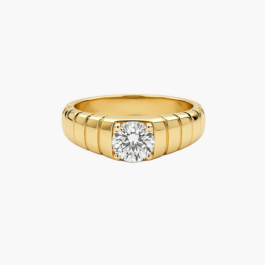 Gold ring with a diamond on a white background