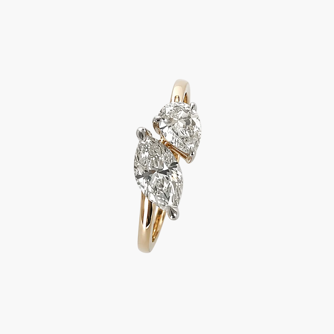 Diamond ring with three circular-cut diamonds on a white background