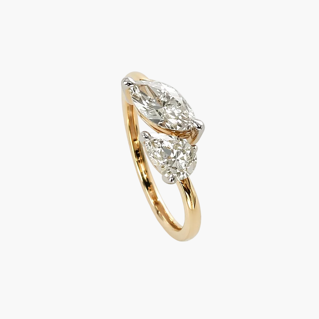 Gold ring with diamond accents on a white background