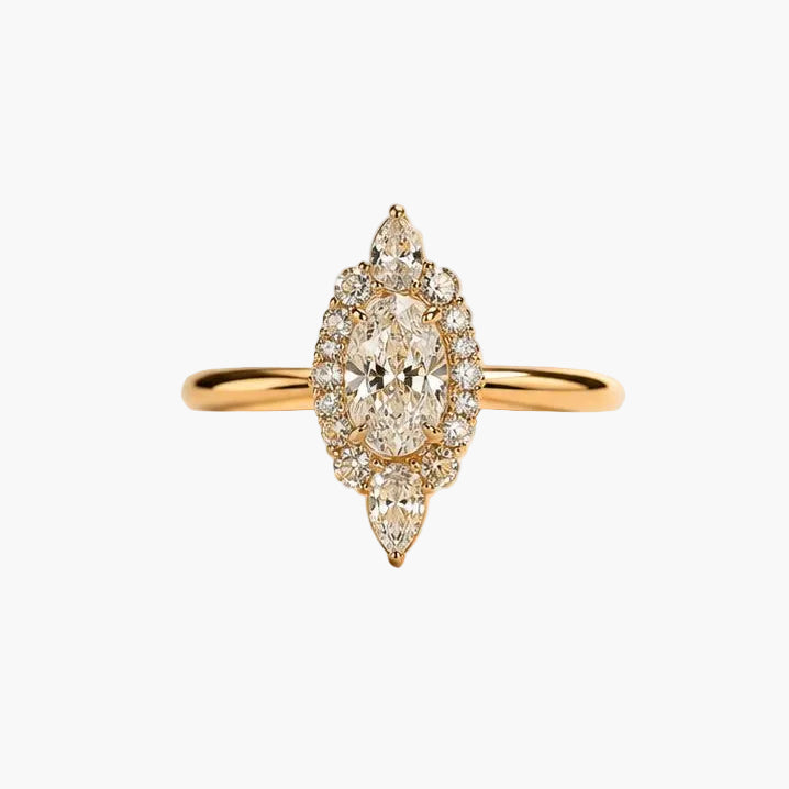 Gold ring with a diamond on a beige background