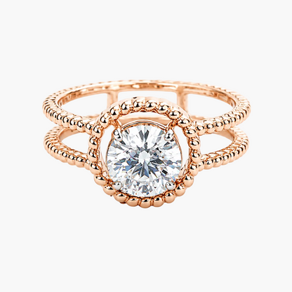 Rose gold ring with a diamond on a white background