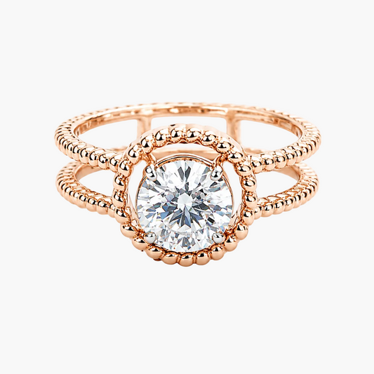 Rose gold ring with a diamond on a white background