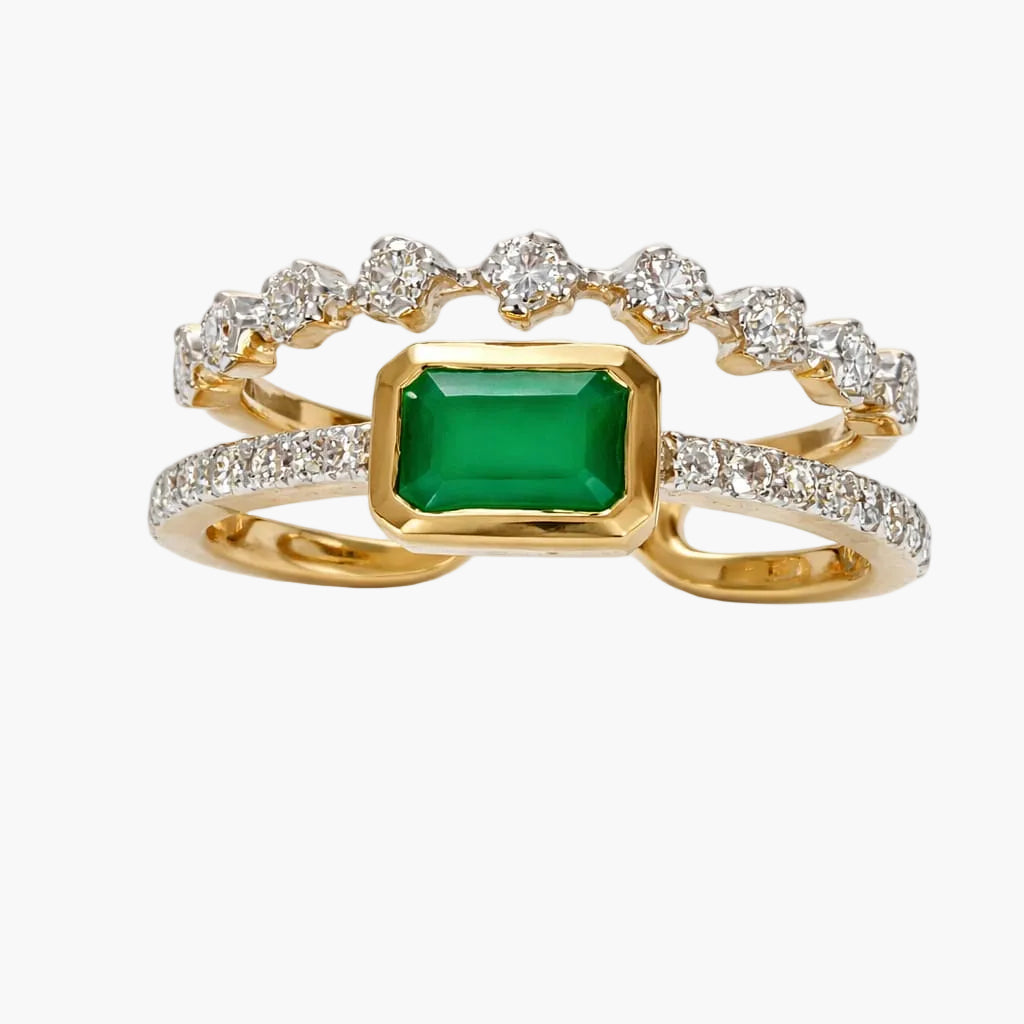 Gold ring with a green gemstone and diamond accents on a white background