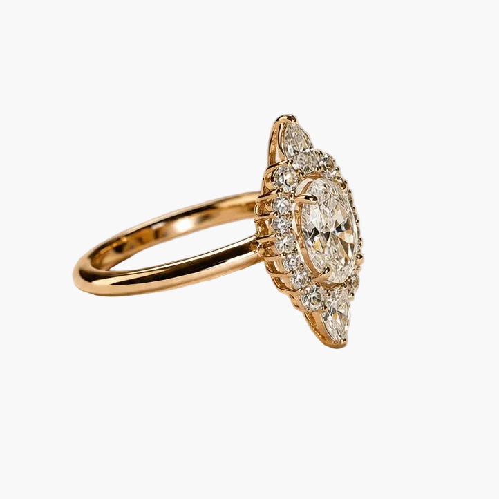 Gold ring with diamond accents on a beige background