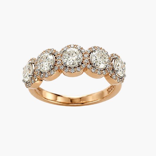 Rose gold ring with multiple diamonds on a white background