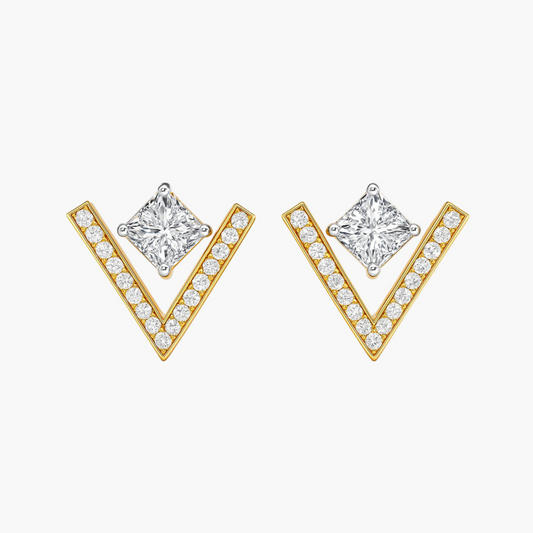 Gold V-shaped earrings with clear gemstones on a white background