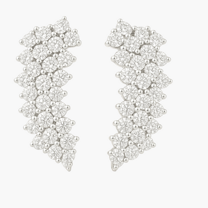 Pair of silver earrings with clear stones on a white background