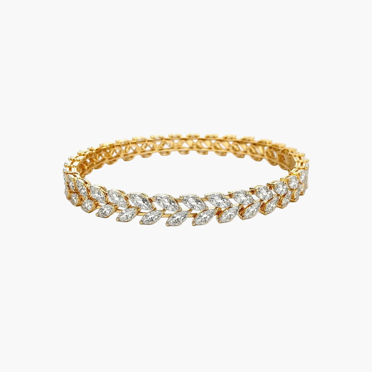Gold bracelet with diamond accents on a white background