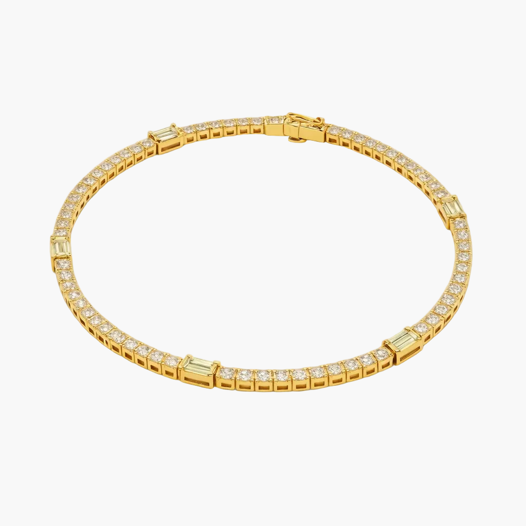 Gold bracelet with diamond accents on a white background