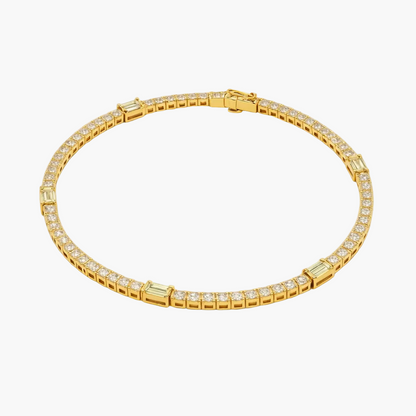Gold bracelet with diamond accents on a white background