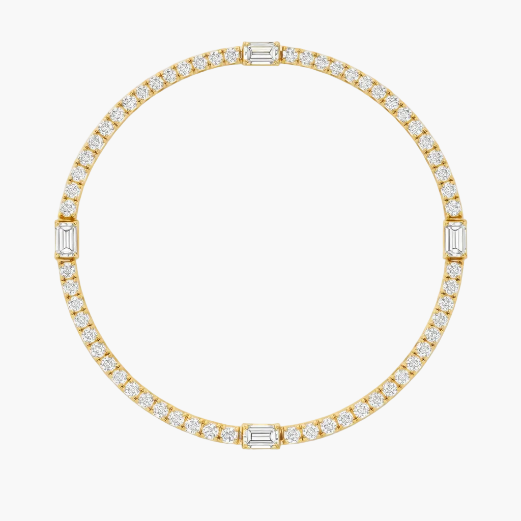 Gold bracelet with diamond accents on a white background